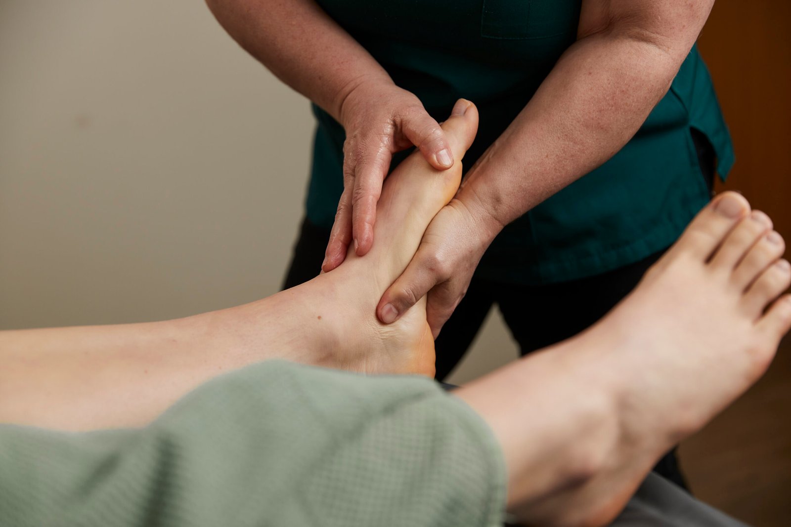 Reflexologist Bernie Hughes treating a patient at Oak Park Clinic in Crondall